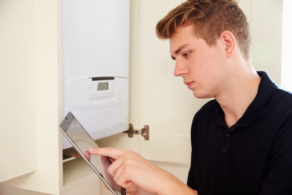 boiler engineer checking boiler maintenance checklist boiler engineer checking boiler maintenance checklist