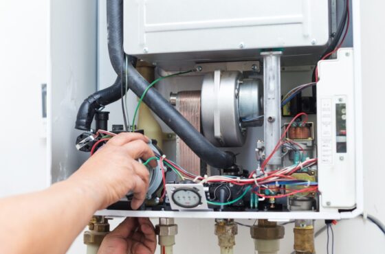 opened boiler exposing inner workings to provide maintenance opened boiler exposing inner workings to provide maintenance