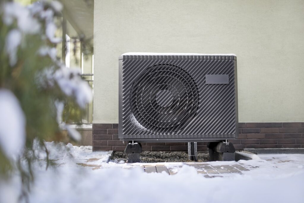 black outdoor heat pump on side of house black outdoor heat pump on side of house